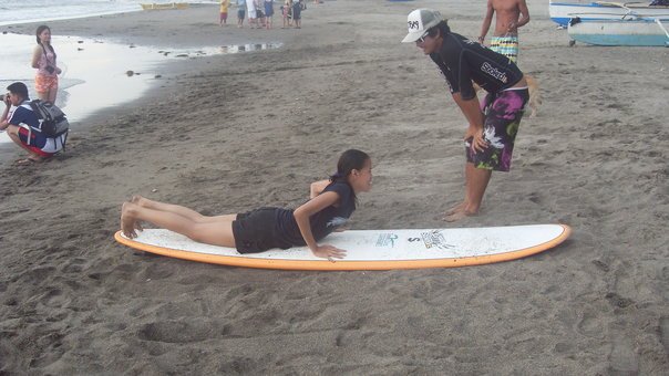 Luke Landrigan teaching the techniques of Surfing