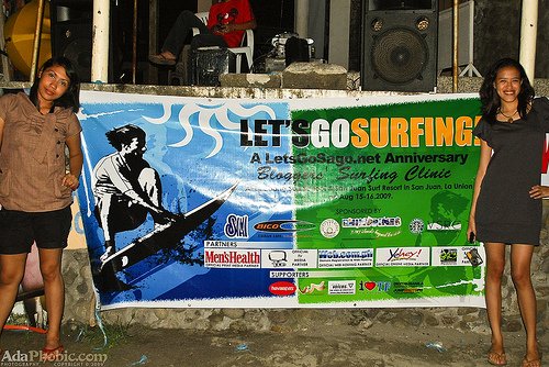 Shena and Mica posing beside the event tarp